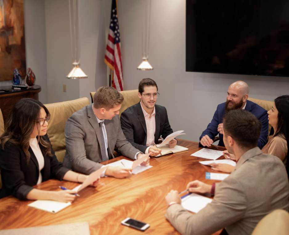 Six Super Woman Super Lawyer team members at work on different types of personal injury cases