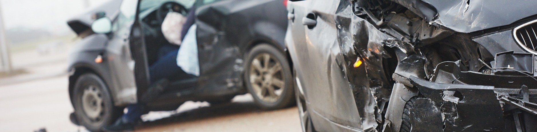 Two cars in a serious car accident, suggesting individuals in need of an auto accident attorney