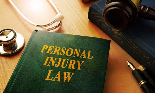 Book on desk reading Personal Injury Law signifying the need for a California Personal Injury Lawyer