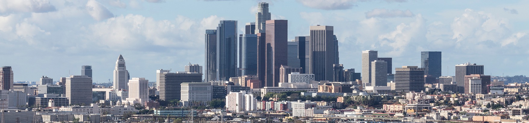 Los Angeles skyline during the day, one of the many areas served by Super Woman Super Lawyer