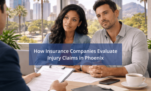 Phoenix personal injury lawyer consultation with client reviewing insurance documents